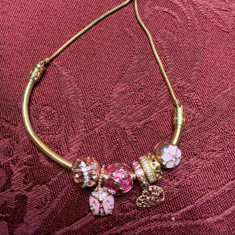 Gold pandora bracelet with charms